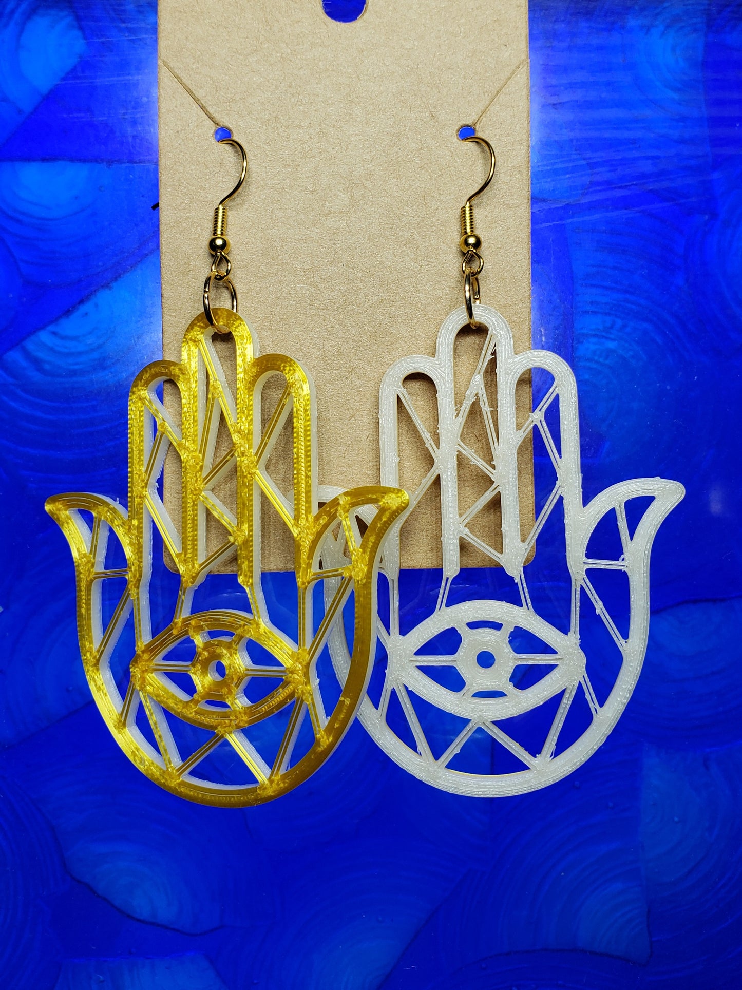 Glow & Gold 3rd eye Hamsa hand dangles